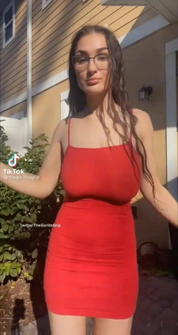TheGorillaGrip slow-mo bouncing in a tight red dress